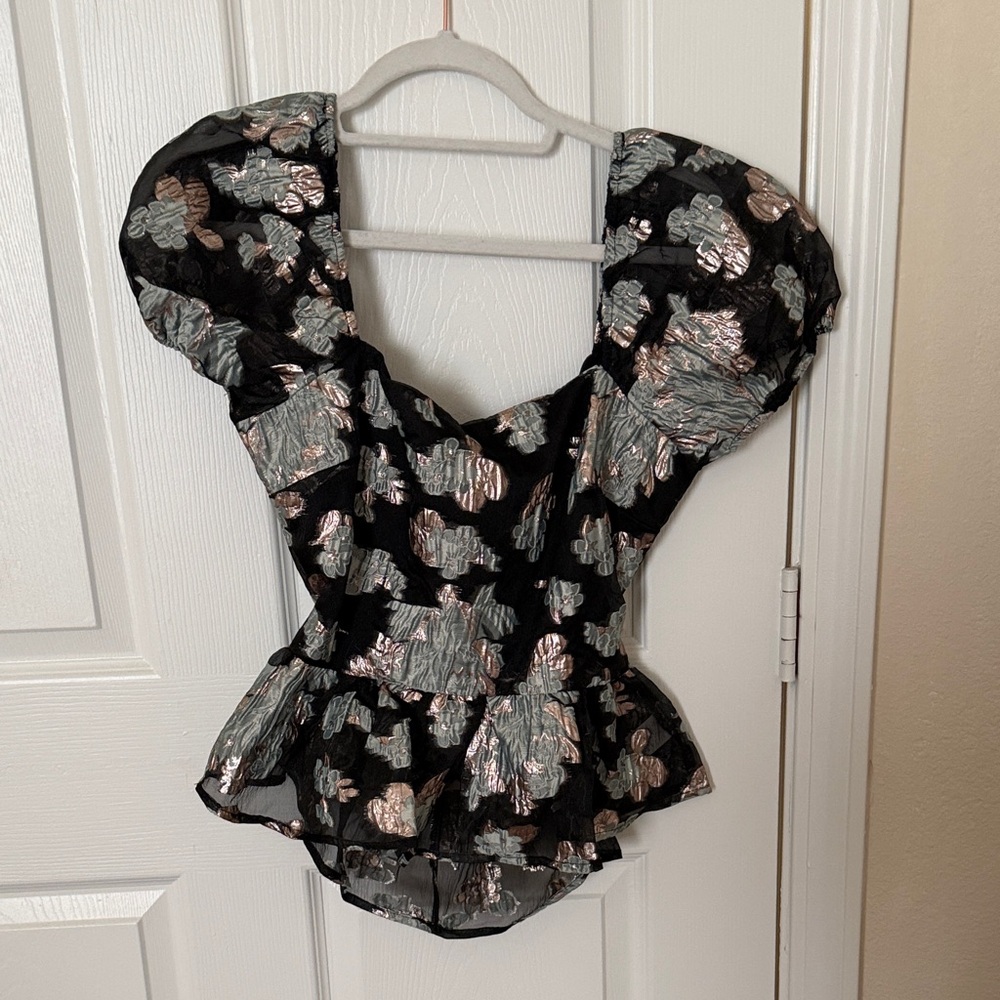 Black floral blouse with puff sleeves and a bow on the back never worn